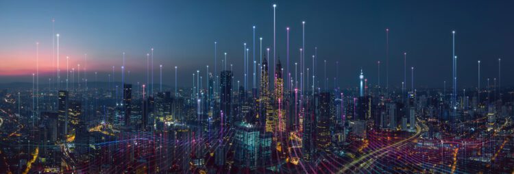 A city skyline at dusk with illuminated skyscrapers, overlaid with digital lines and glowing points representing data connectivity or network communication, visualizing the flow of process intelligence across urban networks.
