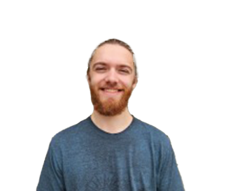A man with a beard and long hair tied back, wearing a blue t-shirt, smiles at the camera against a plain white background.
