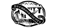Black and white seal of Duchesne County, Utah, featuring mountains, a bridge, a boat, figures in traditional attire, livestock, and the founding year 1915.