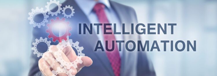 A person in a business suit touches virtual gears on a digital interface, with the words "Intelligent Automation" displayed prominently, highlighting the benefits of intelligent automation in modern business operations.