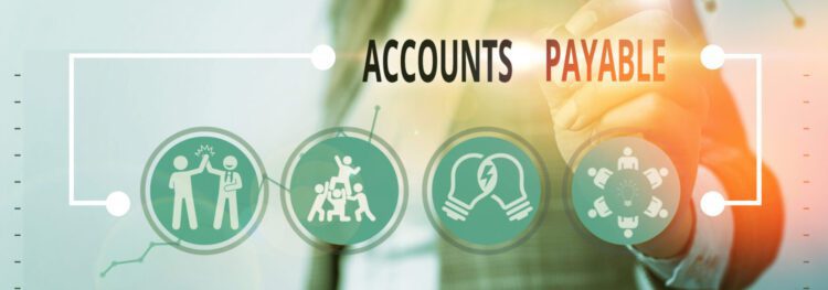 A person writes on a transparent screen displaying "Accounts Payable" above various business-related icons, highlighting AP Automation benefits.