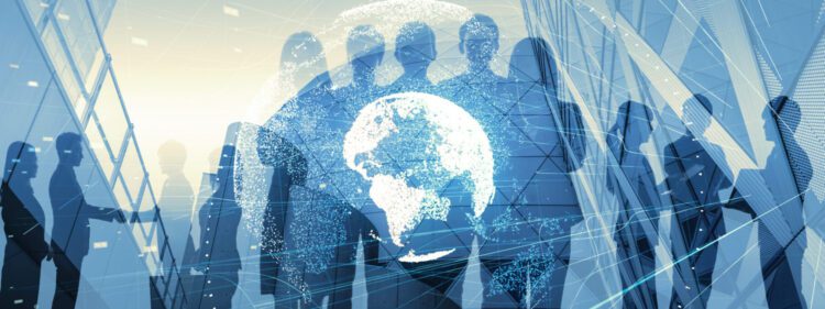 Silhouettes of business people standing and talking, overlaid with a digital globe and network lines, highlight global business networking and the advantages of automation in accounting.