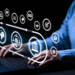 Hands typing on a laptop keyboard with digital icons representing technology, AI, data, and business concepts overlaid above the device.